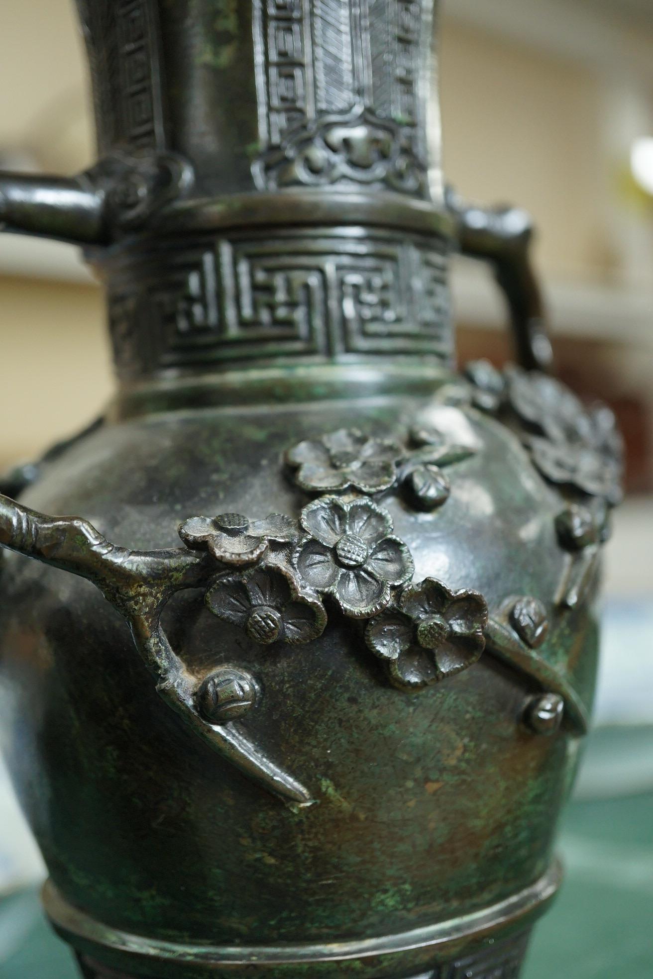 A pair of Chinese bronze gu-shaped vases, Qing dynasty